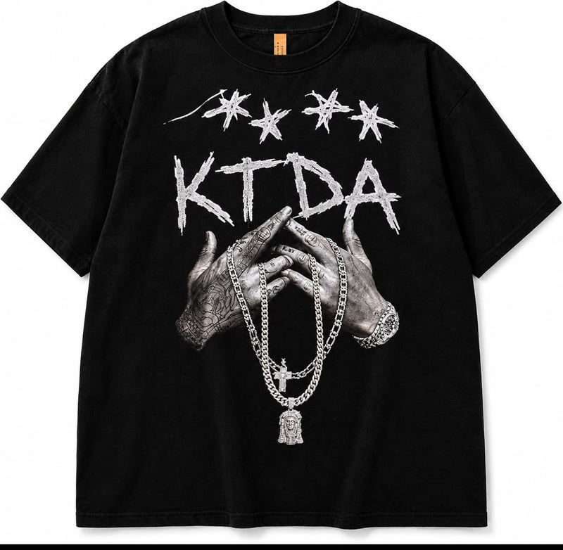 Black KTDA Signature graphic T-shirt with distressed lettering, illustrated hands and monochrome chain artwork.